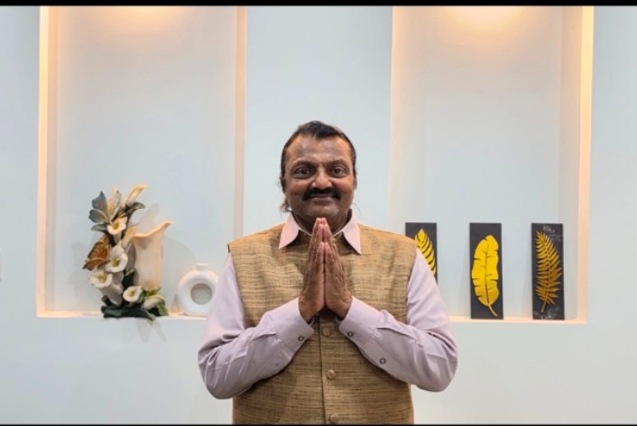 Dr. Harish Kumar greeting with folded hands